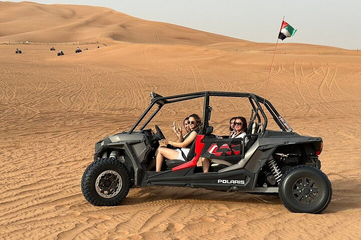 Experience the thrill of self-driving an ATV across golden dunes where adventure meets stunning desert scenery followed by a delightful dinner under a star-studded sky in Dubai.